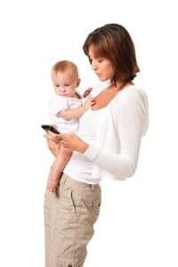 Mother and Baby Infant Child with Mobile Phone on White